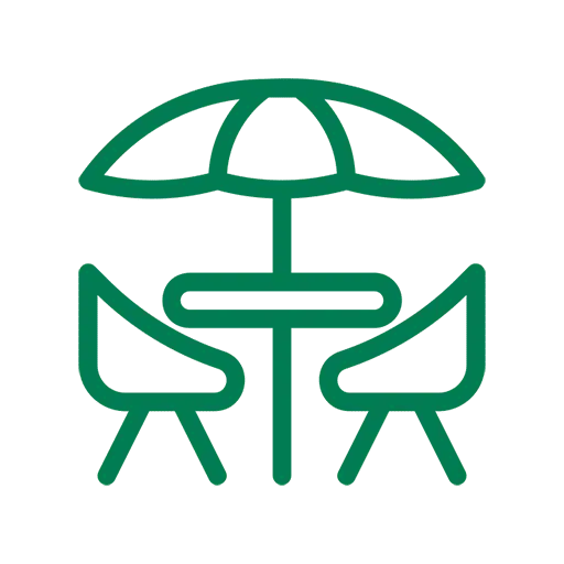 Green table and chairs icon with umbrella.